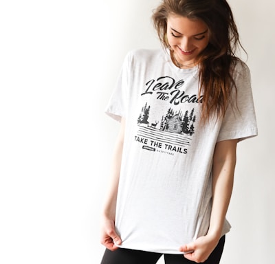 smiling woman in black and white print t-shirt