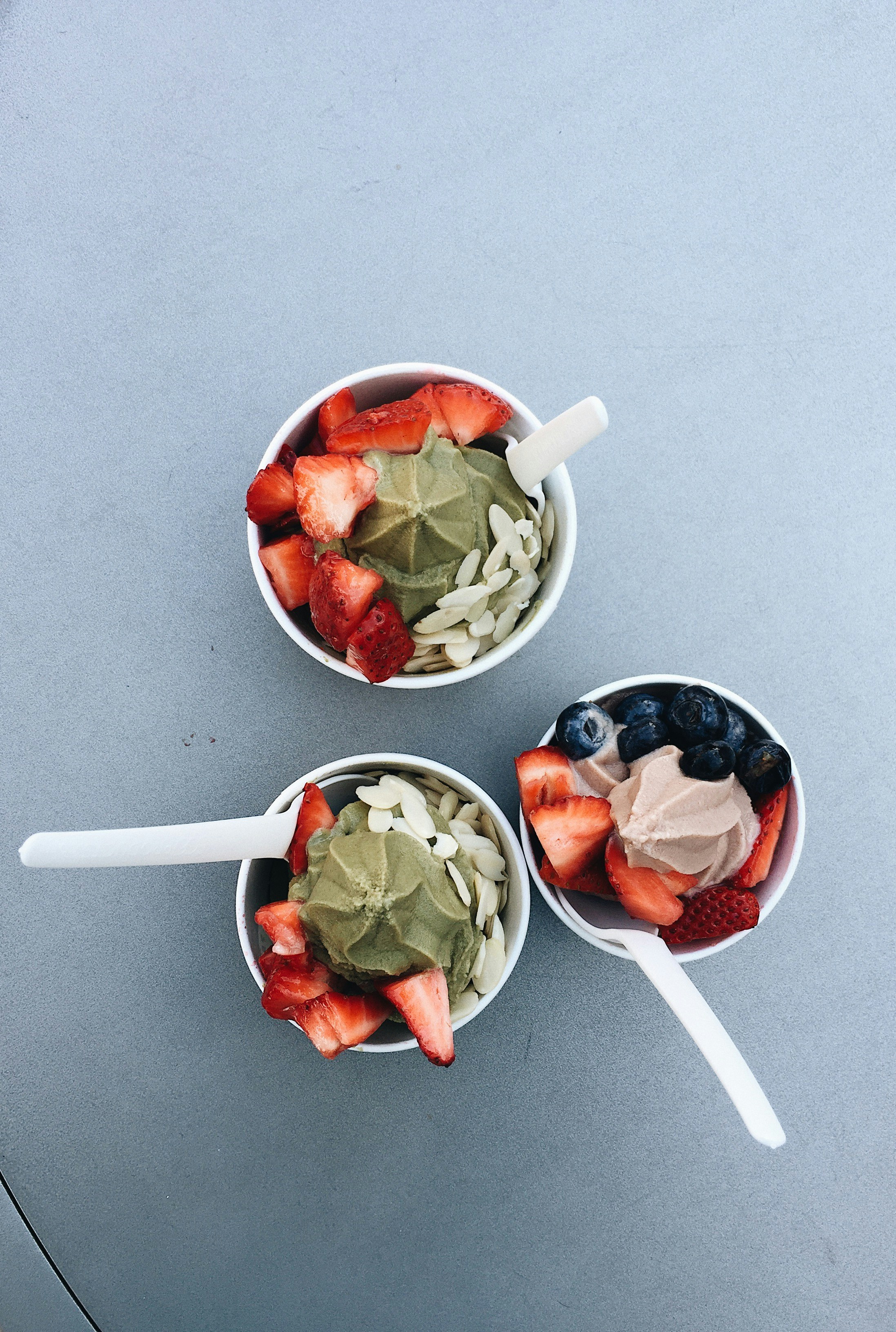 three cups of fruit salads