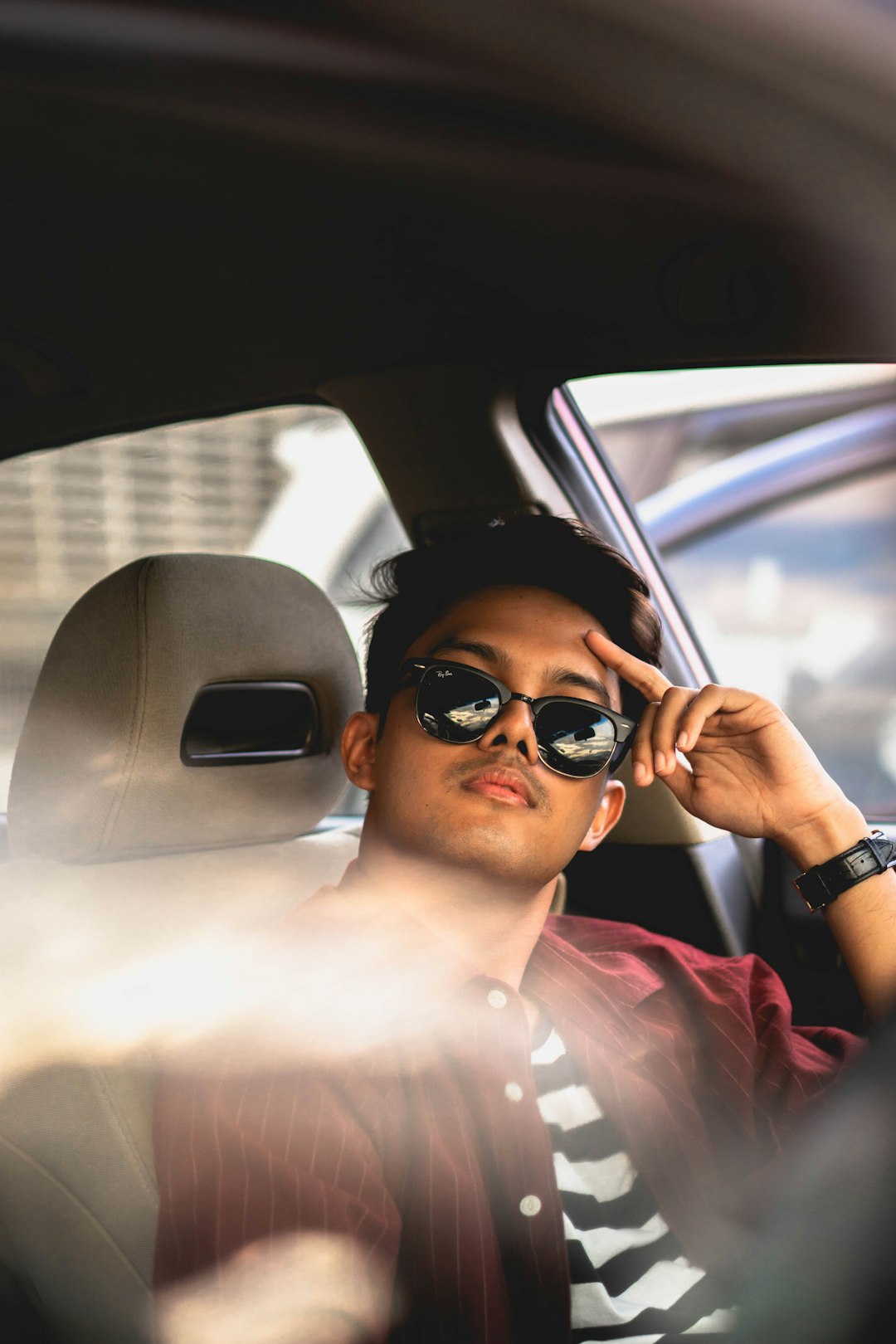 man in sitting on car seat