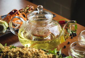 A vibrant spread of healthy dishes paired with cups of refreshing green tea.