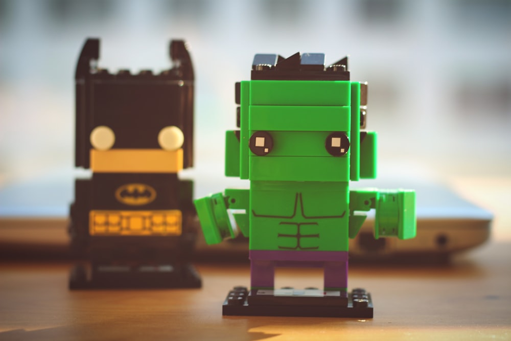 two Lego Hulk and Batman toys