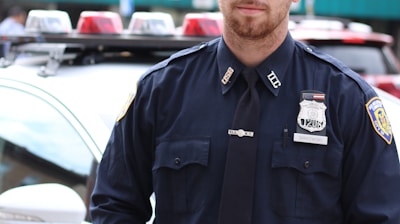 selective focus photography of policeman