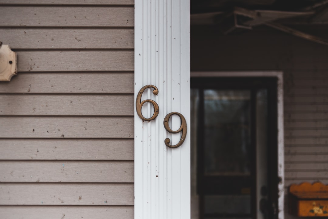 69 on wall close-up photography