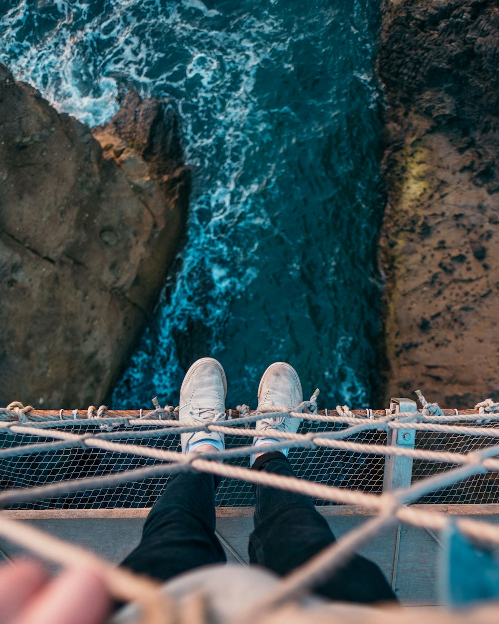 person standing over body of water