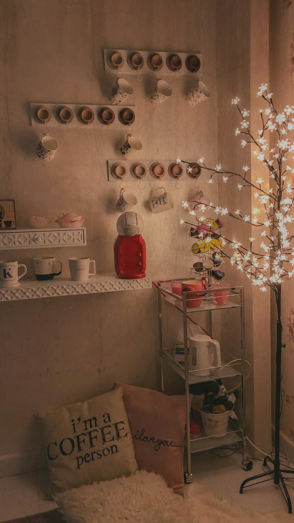 white ceramic mugs hanged on white wall