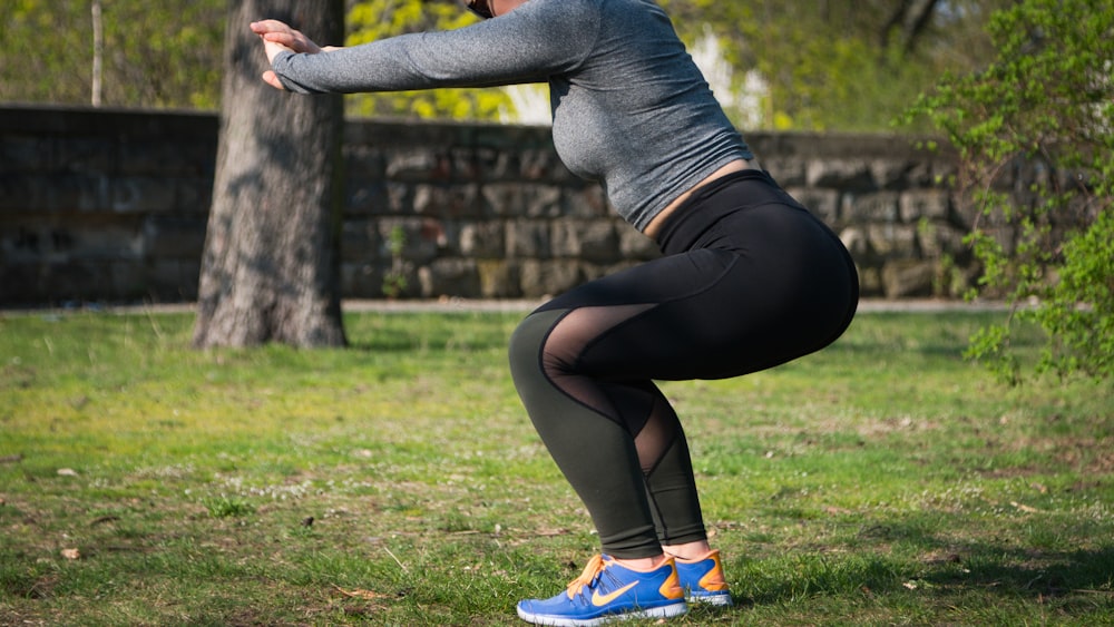 person squatting during daytime