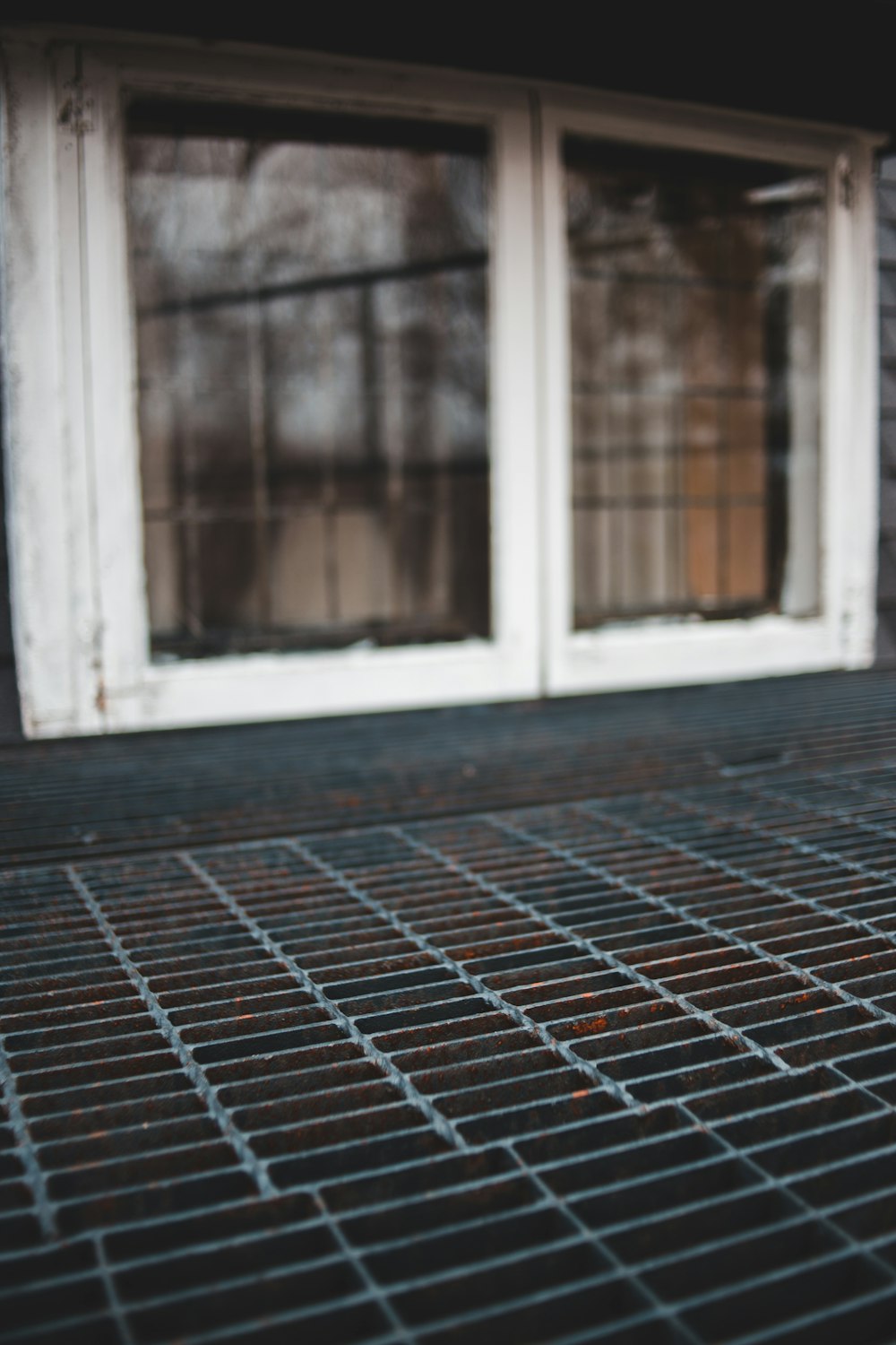 shallow focus photo of white wooden window