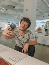 A close-up of a Disney resort reservation confirmation on a smartphone screen with Mickey Mouse ears in the background.