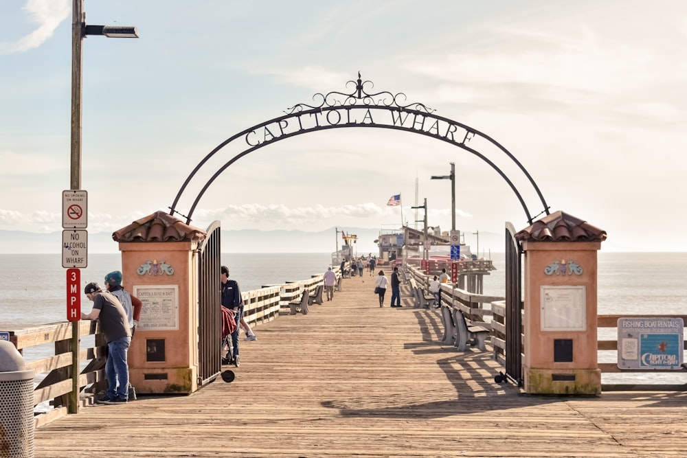 people standing on dock