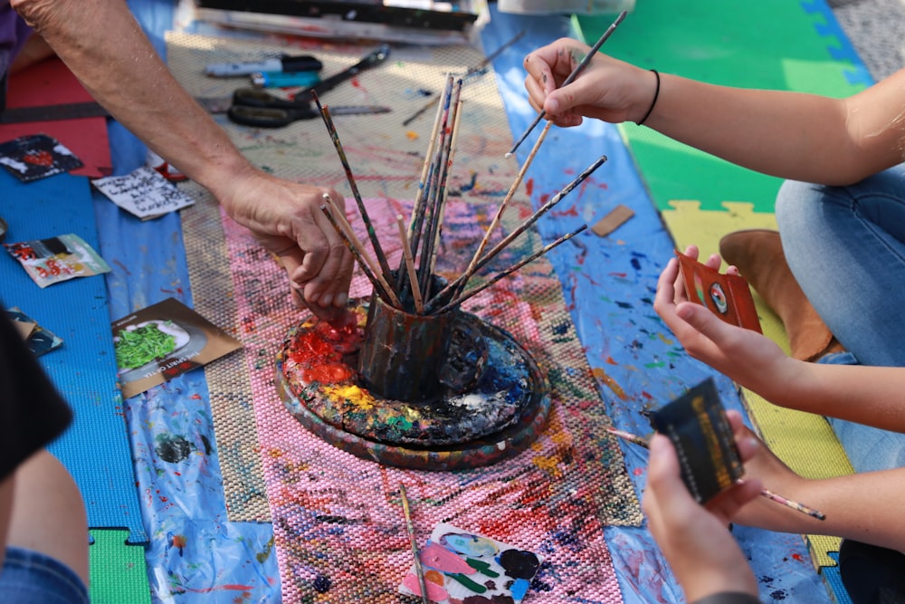 round can with paint brushes