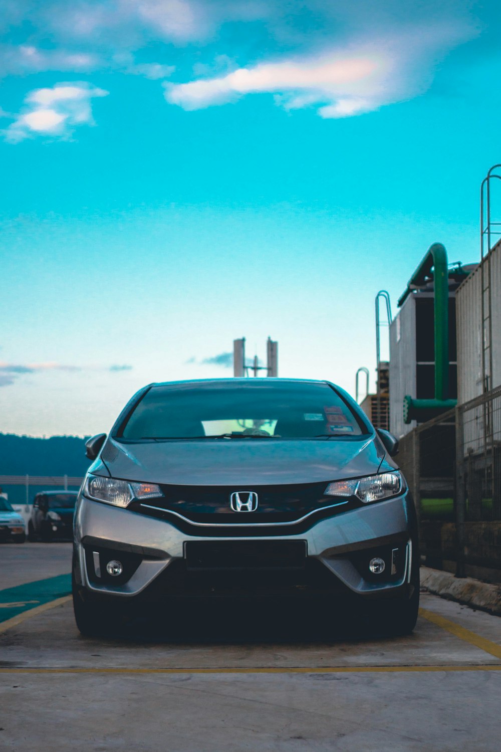 gray Honda vehicle on concrete road