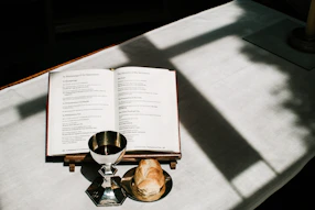 A close-up of the communion elements on a simple wooden table, inviting quiet reflection.