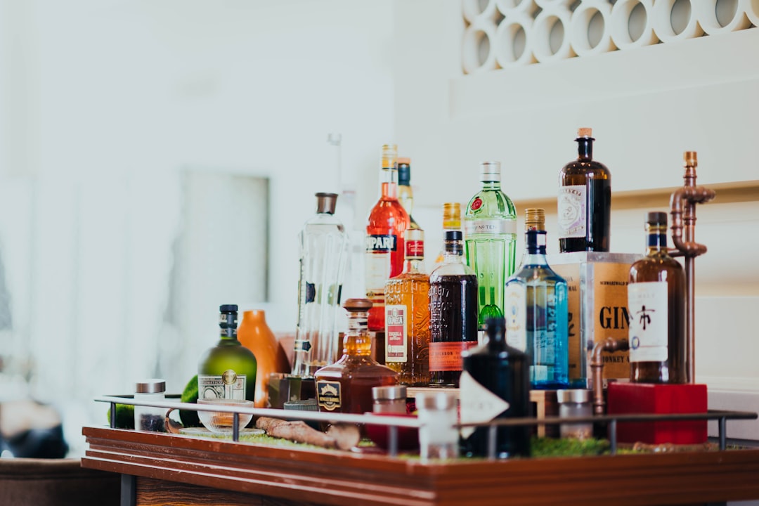 assorted liquor bottles on table