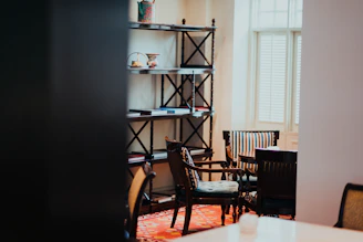 A cozy, sunlit room featuring neatly arranged colorful storage boxes from cajaviva on shelves and under tables.