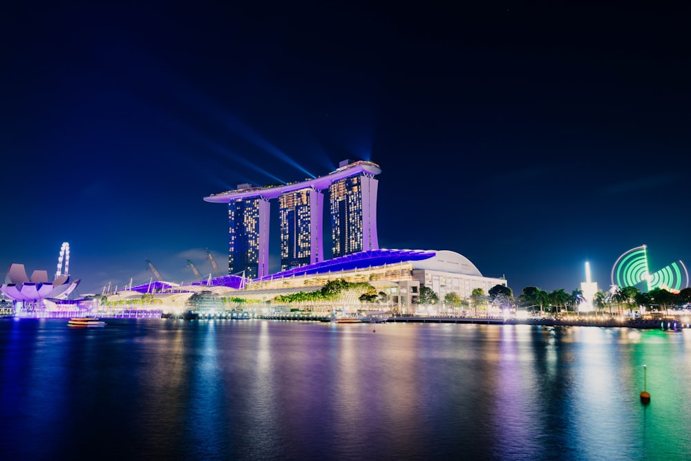 purple lighted Marina Bay Sands building at nighttime