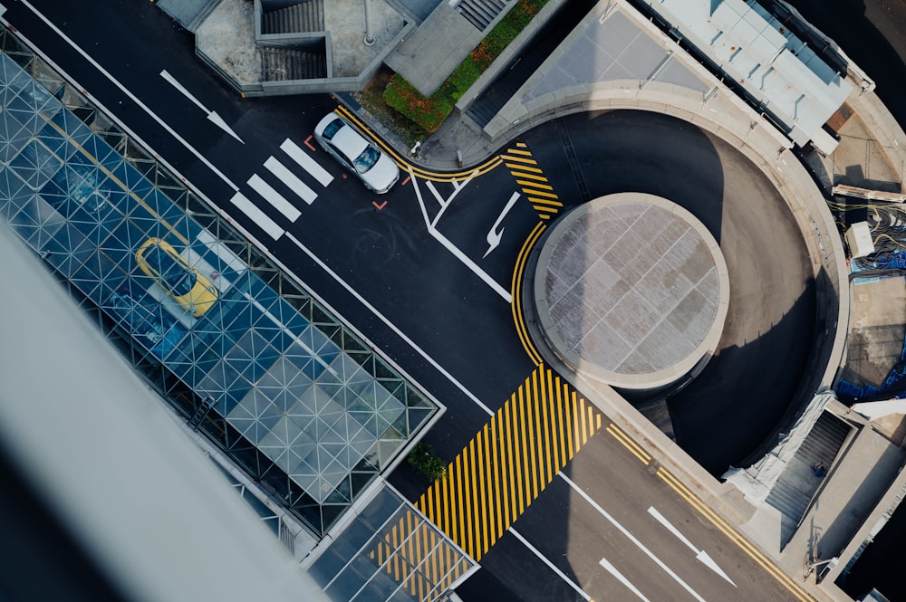 high angle view photography of yellow car on road