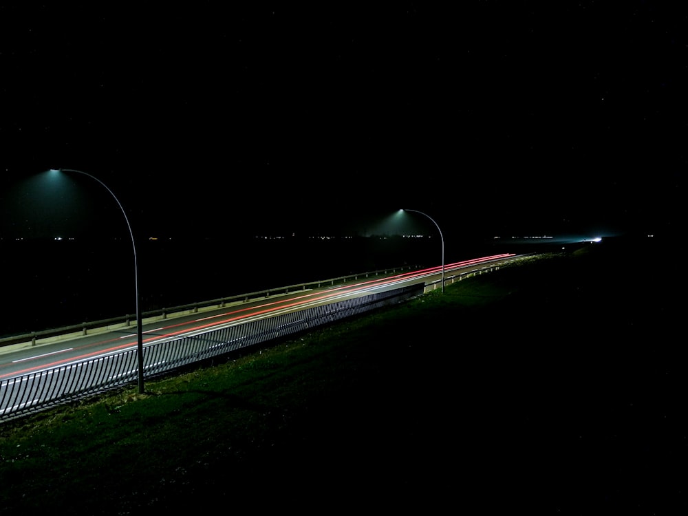 timelapse photography of road at night