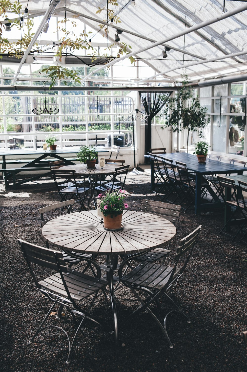 round gray table with chairs inside building