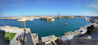 A panoramic view of Erie’s harbor filled with boats under a bright blue sky.