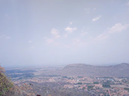 Wide panoramic view of the Guanacaste plains under a clear blue sky from the farm.