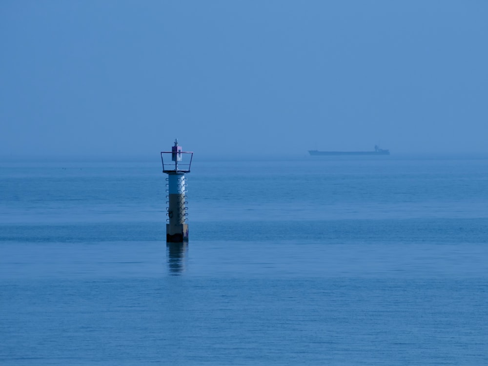white and brown tower on calm sea