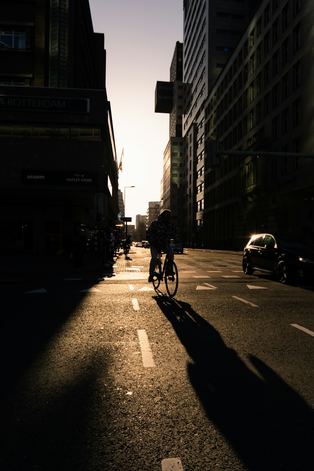 silhouette photography of person riding bicycle