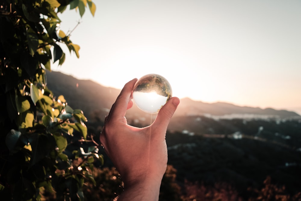 view of sun through clear glass sphere