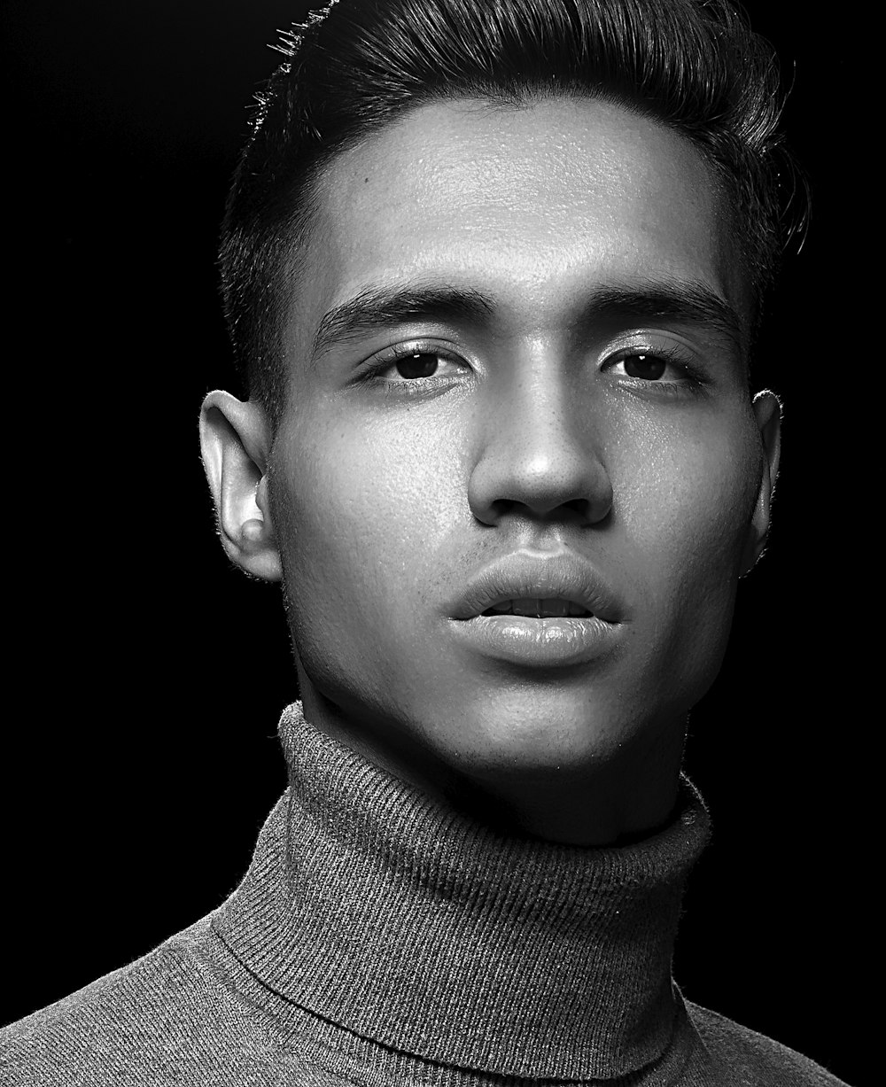 grayscale photography of man in turtle neck top