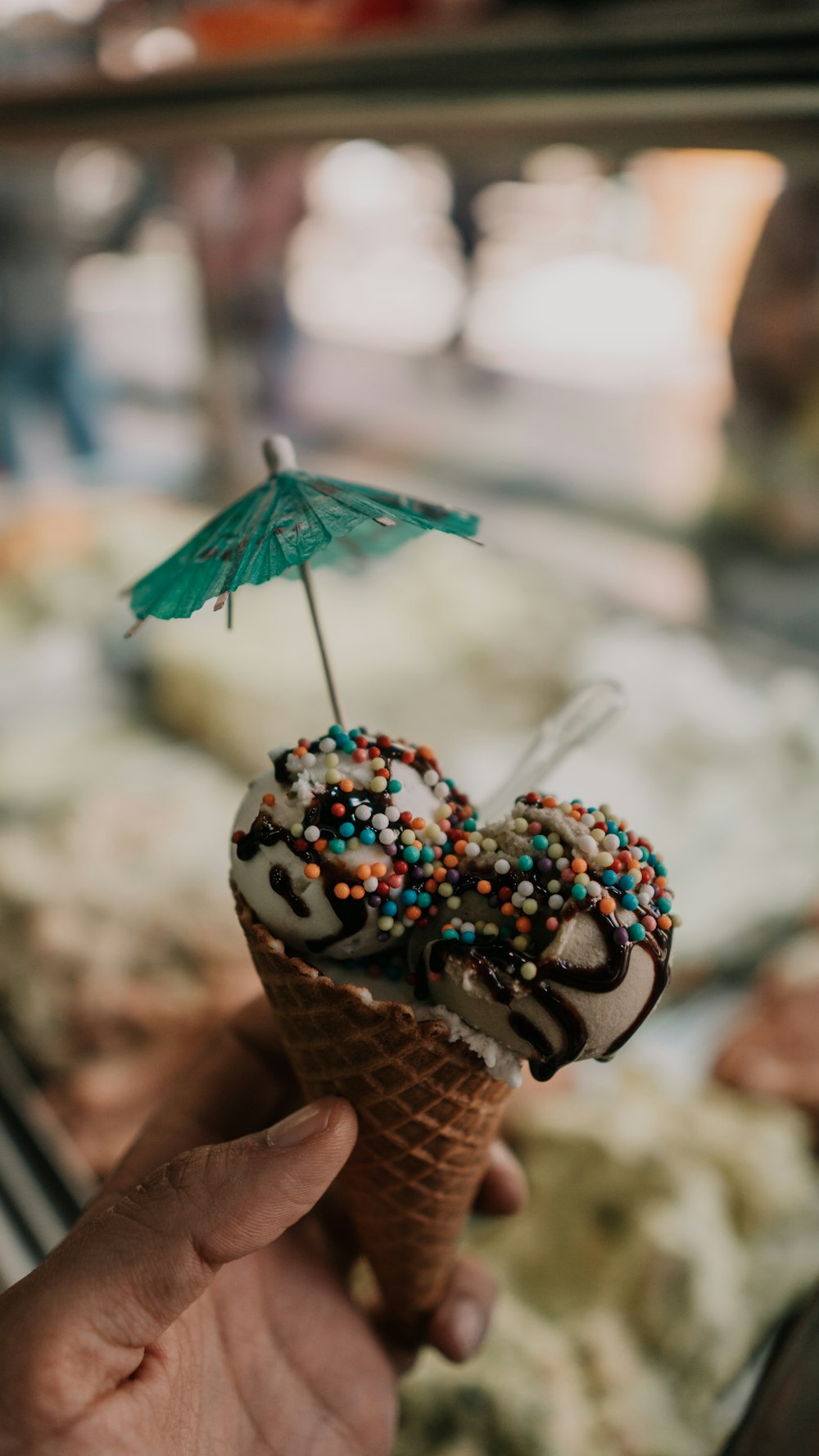 person holding ice cream cone