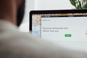 a man is looking at a computer screen