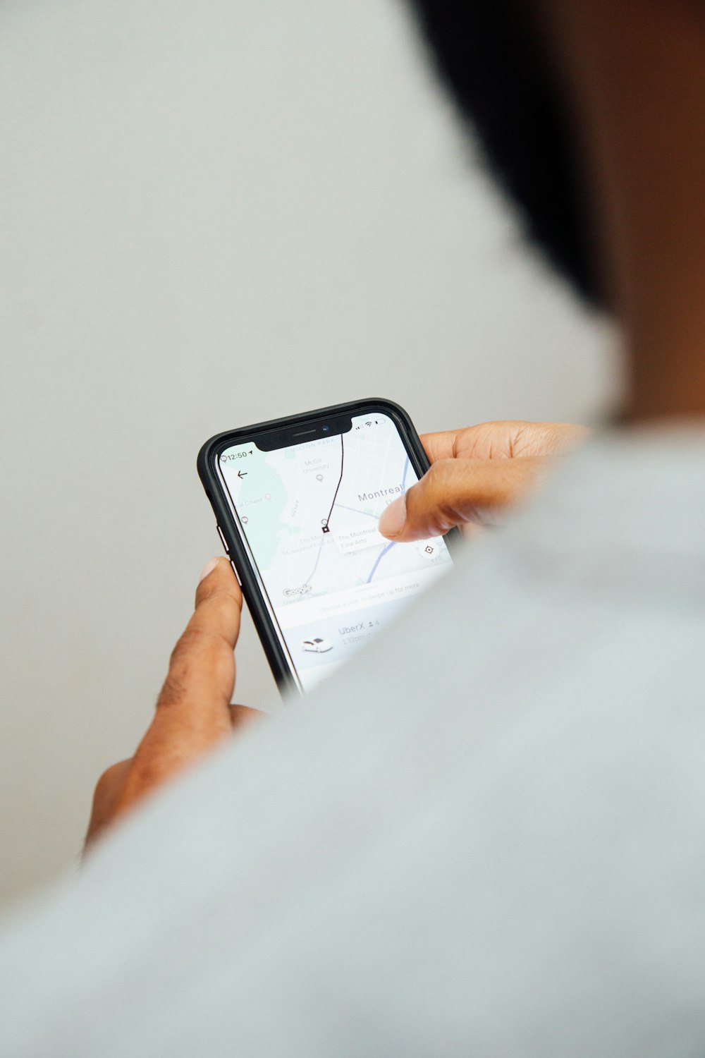 man using turned-on smartphone