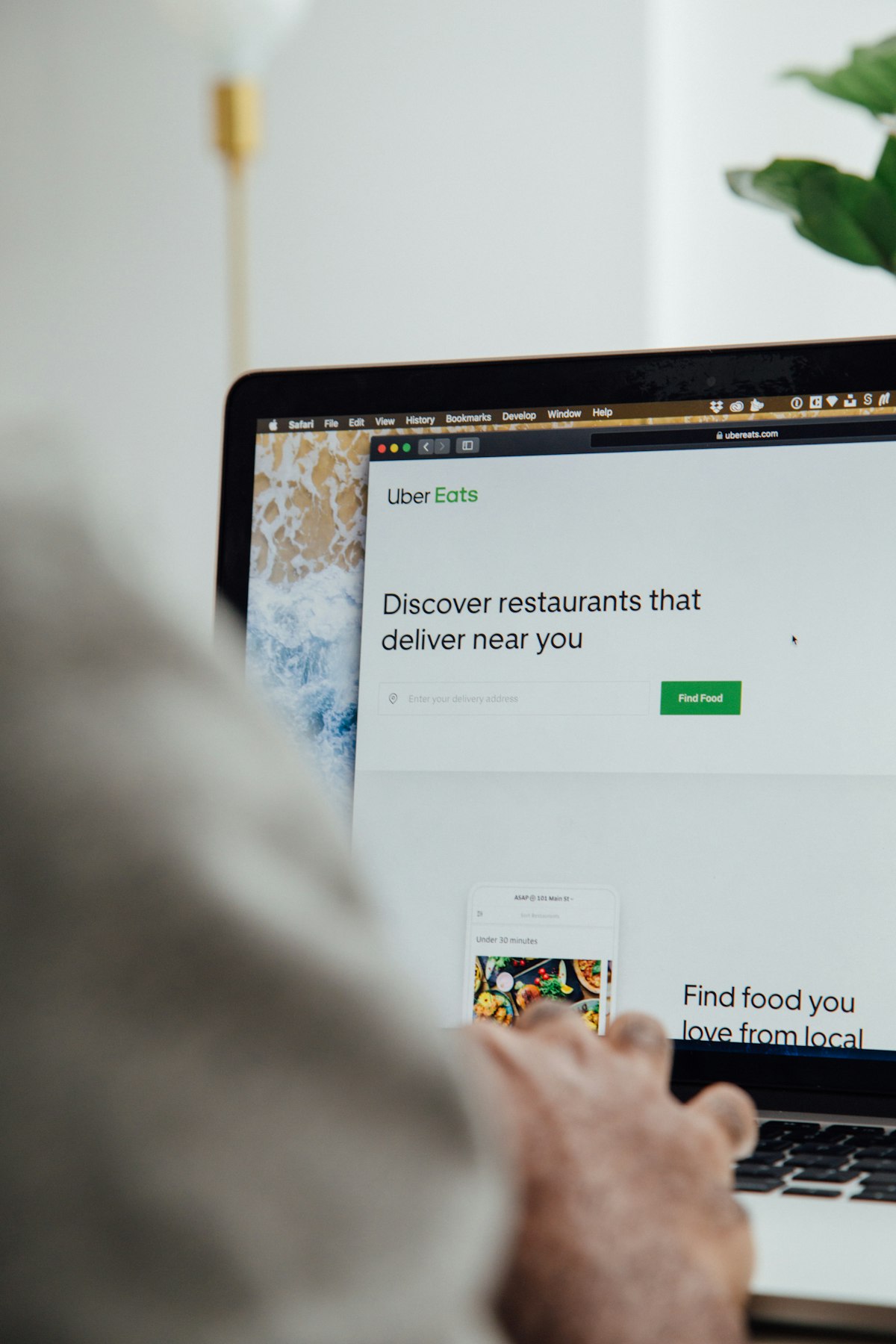 Professional reviewing online review data on a laptop screen