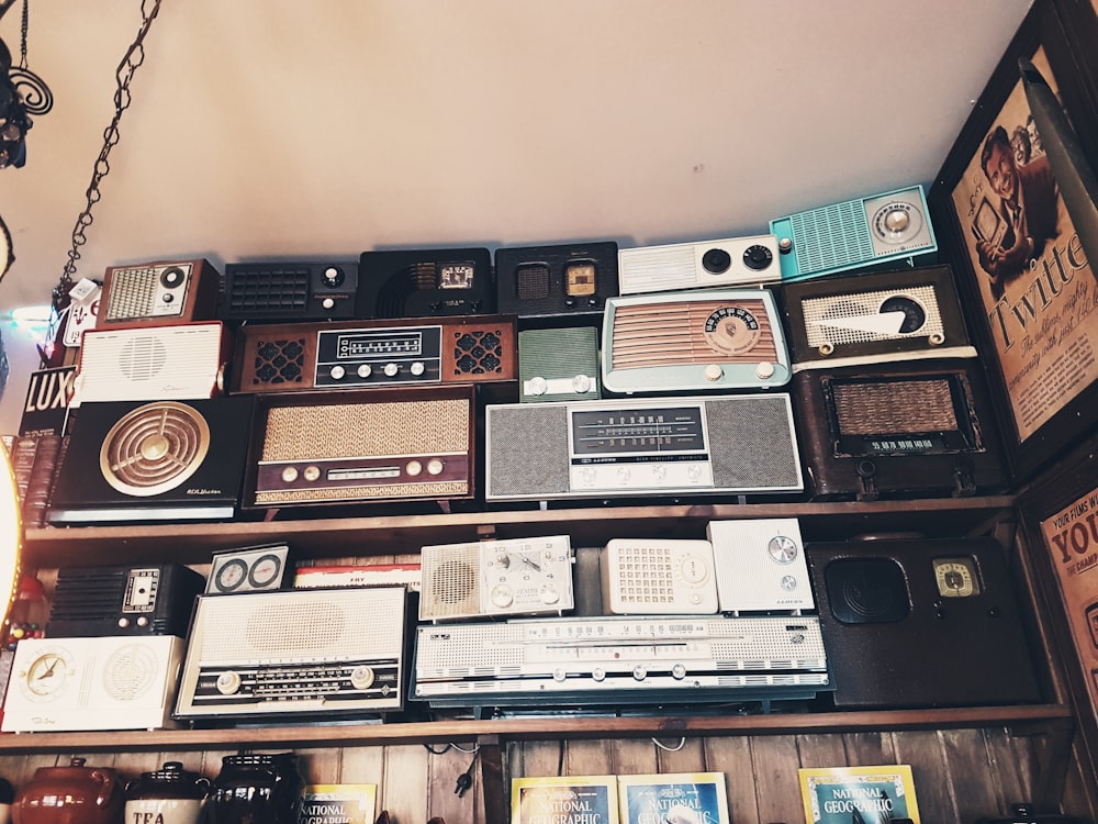 assorted radio collection on rack