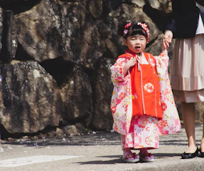 Children and parents participating in a traditional Japanese sustainable art workshop with local Okinawan artists.