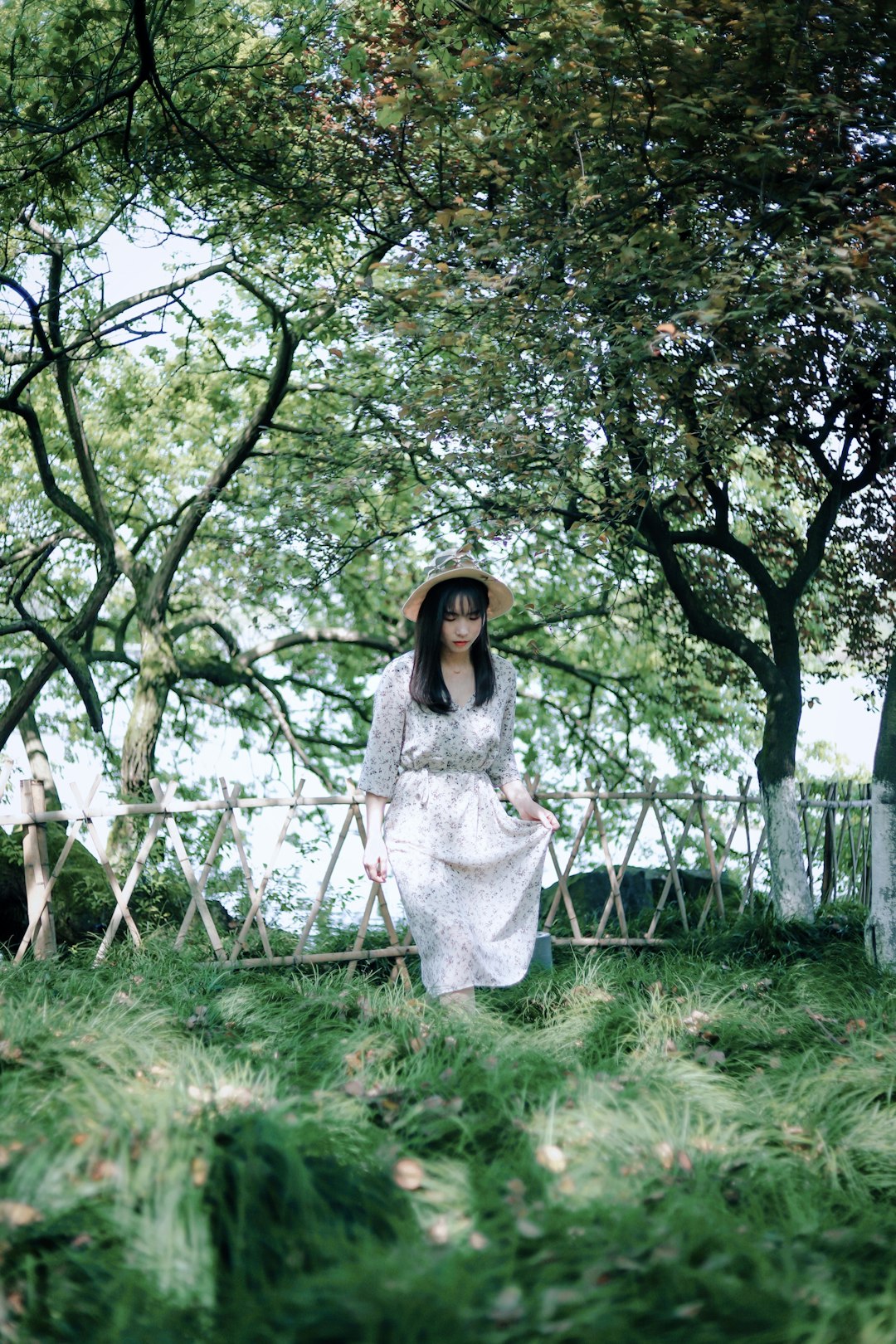 woman standing on green grass field