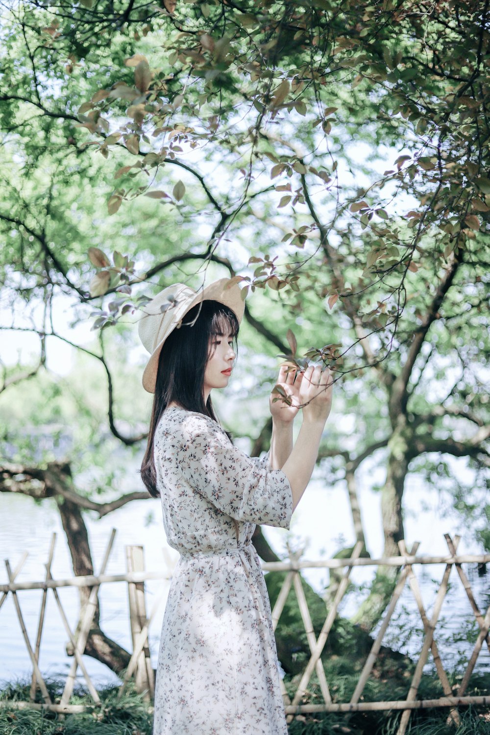 woman wearing gray and white floral dress