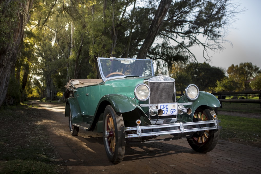 green convertible car on trail