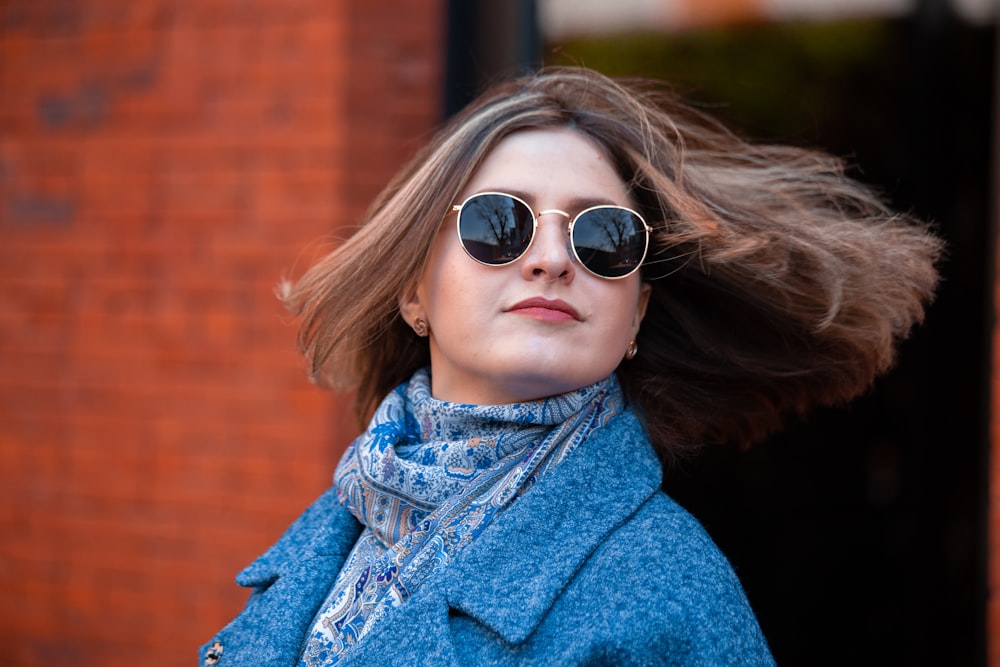 woman wearing blue and grey scarf