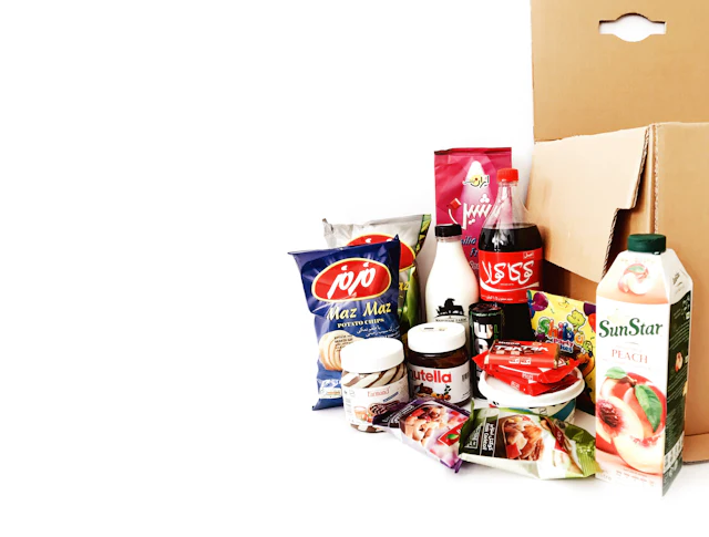 Box of assorted packaged grocery items