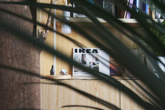 a wooden shelf with a magazine on top of it