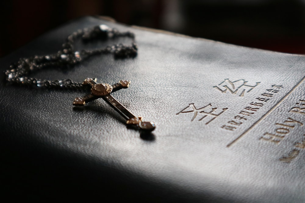 selective focus photography of rosary