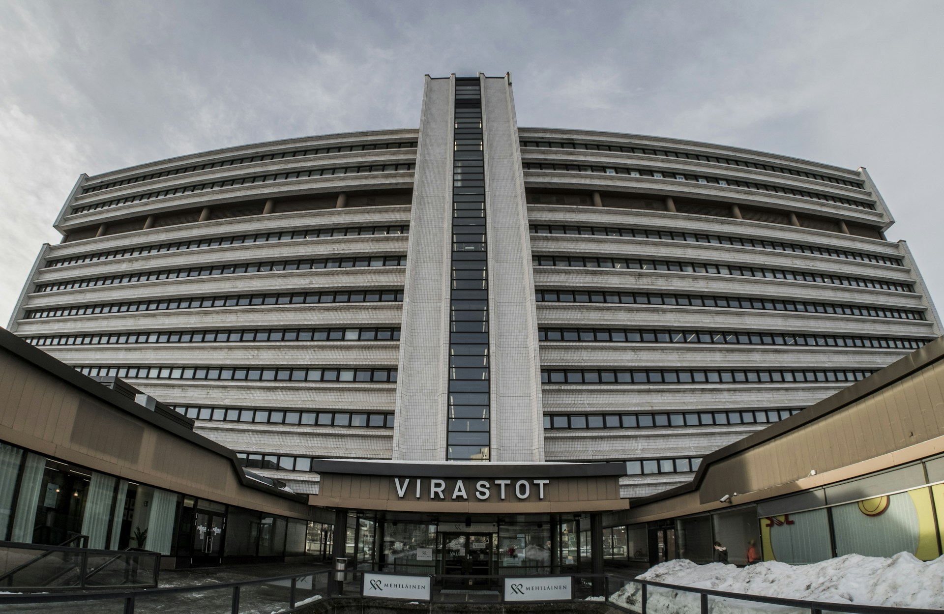 woman wearing yellow long-sleeved dress under white clouds and blue sky during daytime