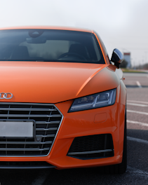 orange Audi vehicle