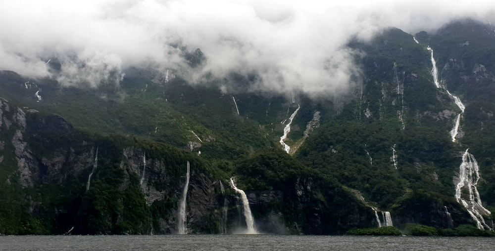 waterfall covered with fog