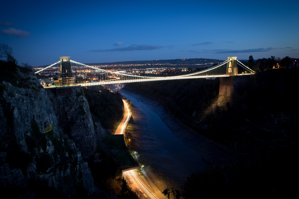 lighted bridge under blue sky