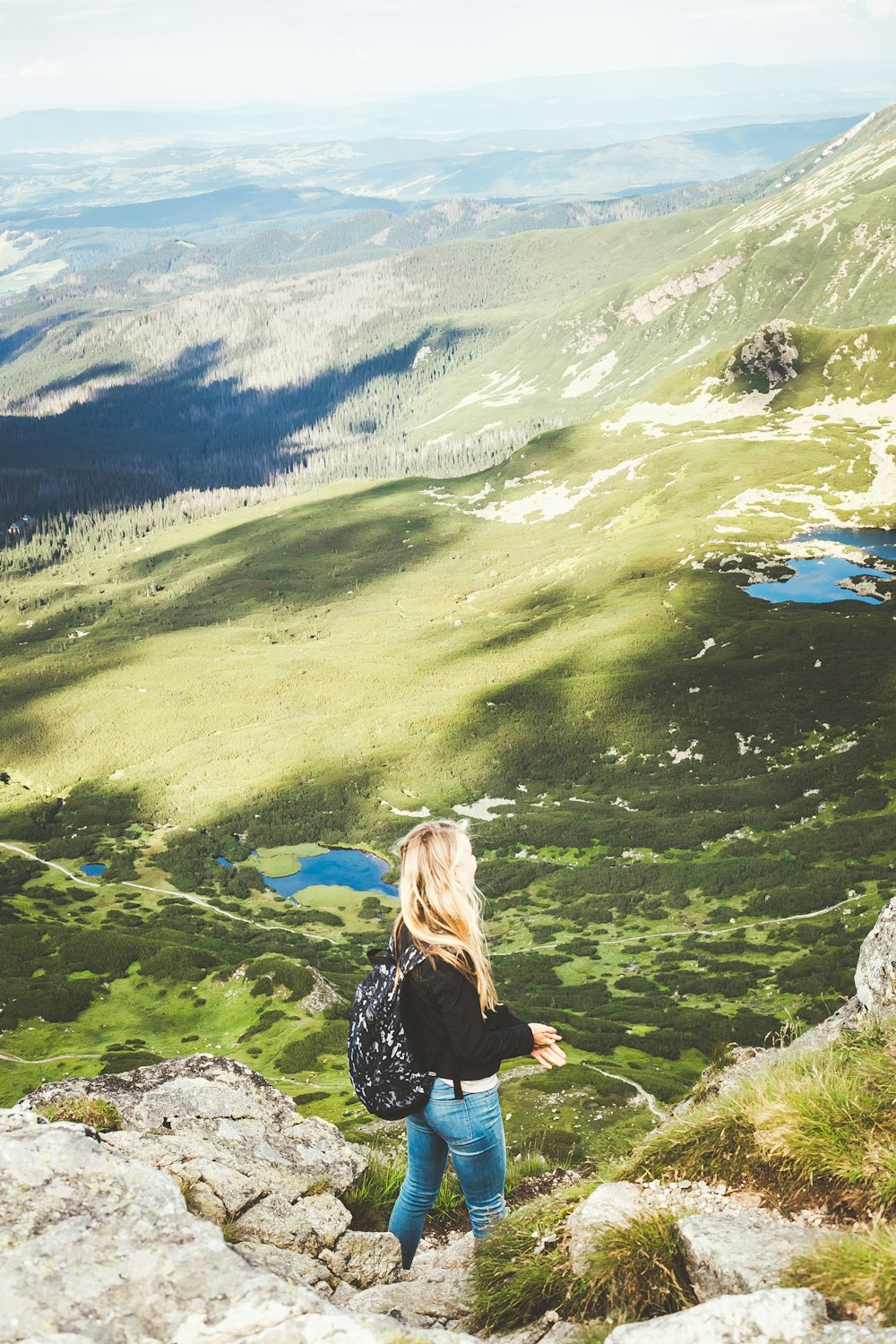 woman standing on mountain during daytime
