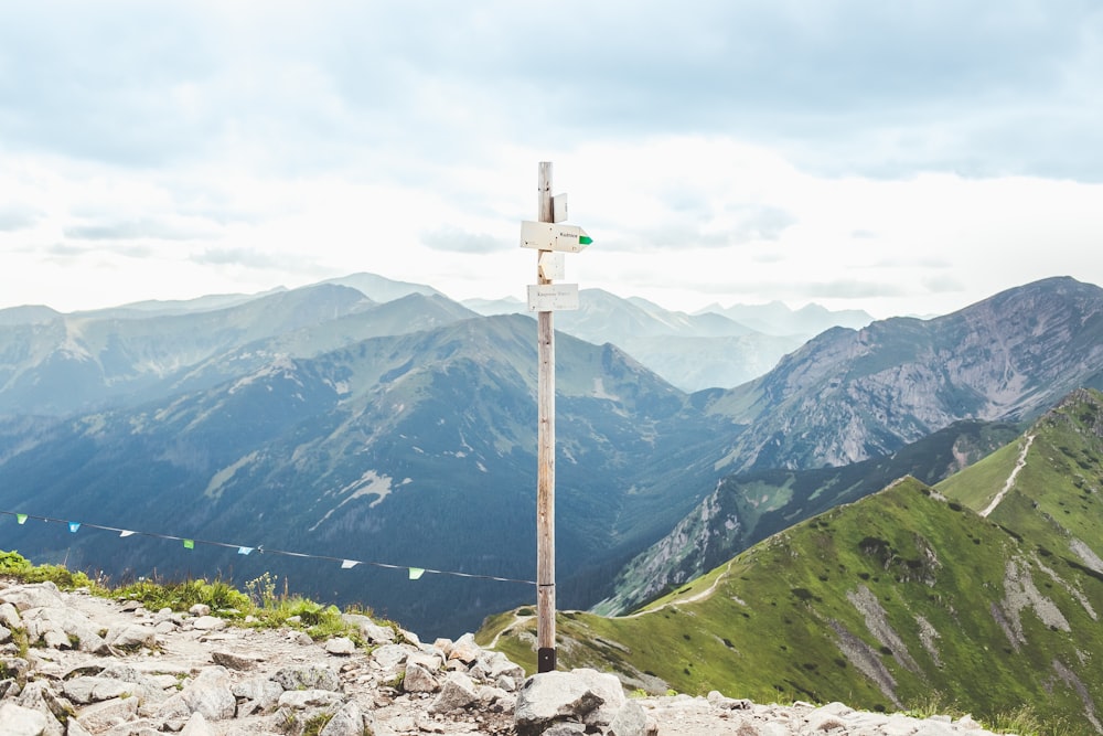 white signage on top of mountain