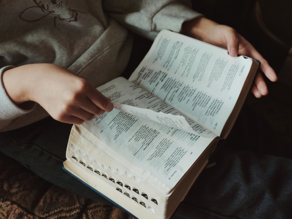 person holding book