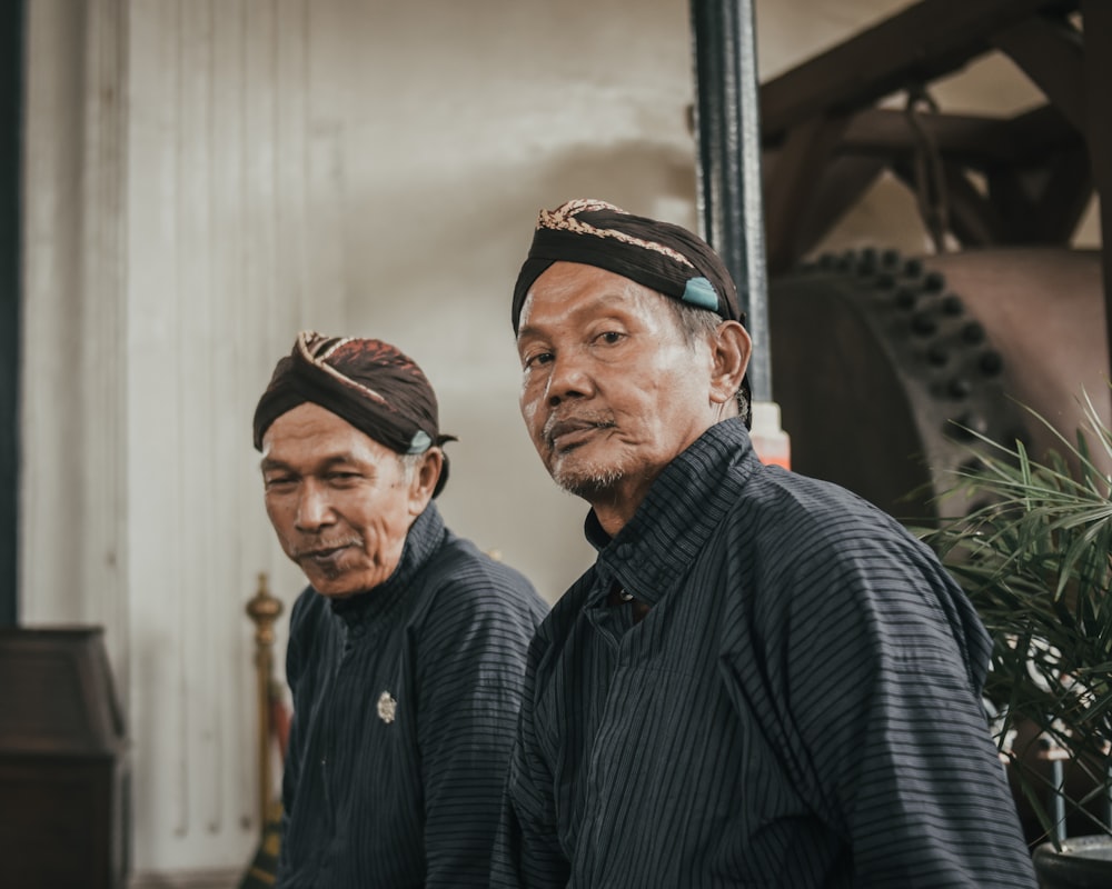 two man standing inside room