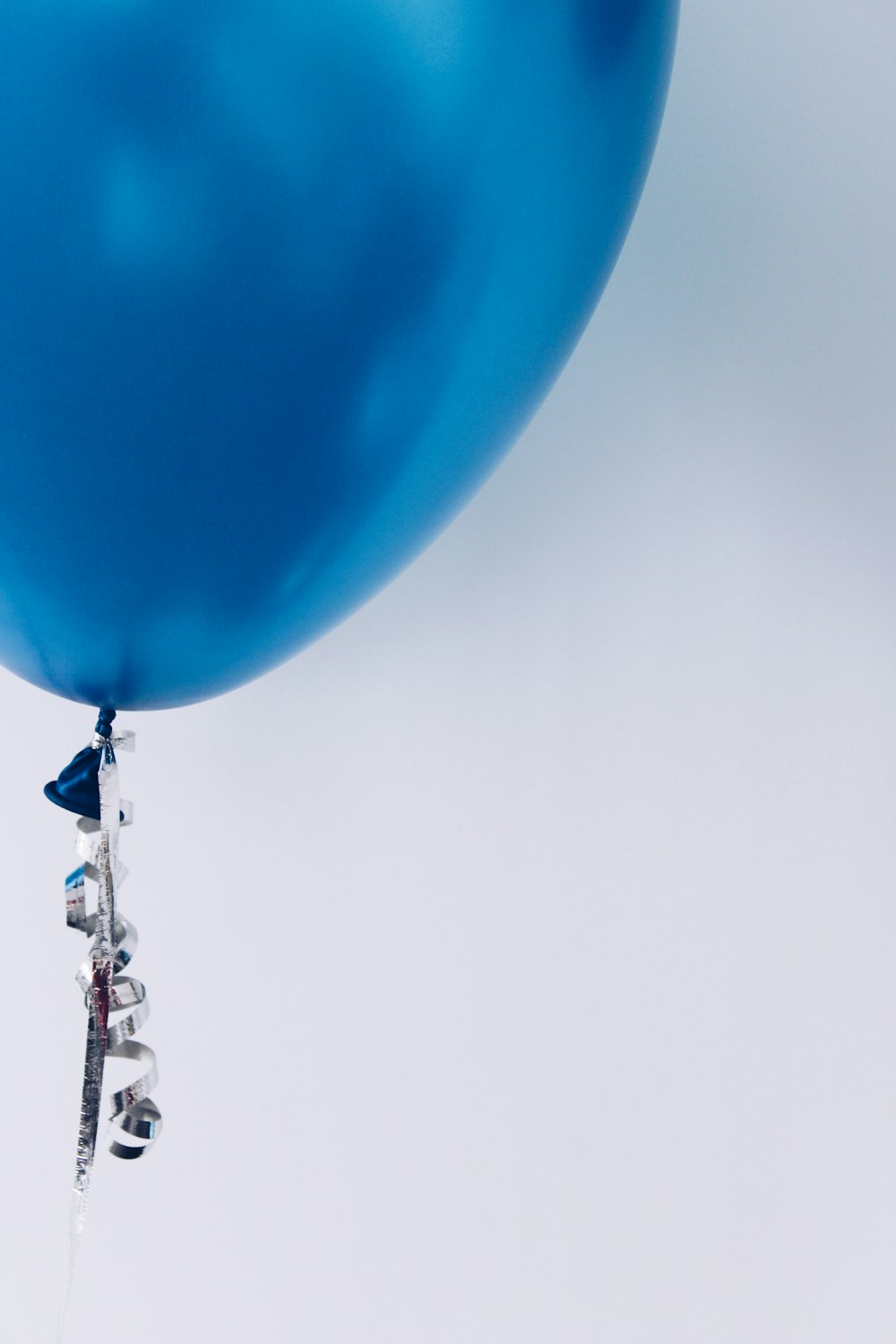 blue flying balloon